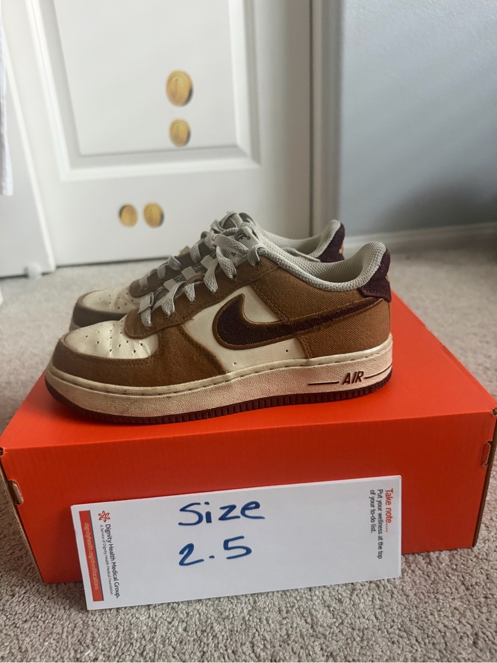 Nike Kids Low-Top Sneakers in Brown and Cream with Dark Brown Swoosh